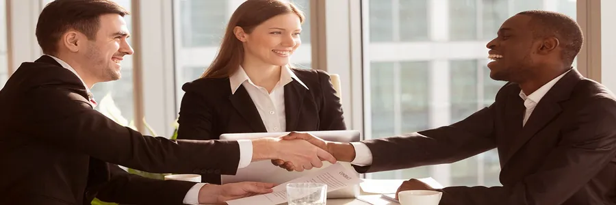 Business partners shaking hands to start a software business with AxoOne